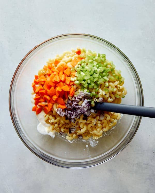 Hawaiian style macaroni salad ingredients in a bowl.