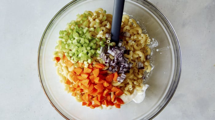 Hawaiian style macaroni salad ingredients in a bowl.