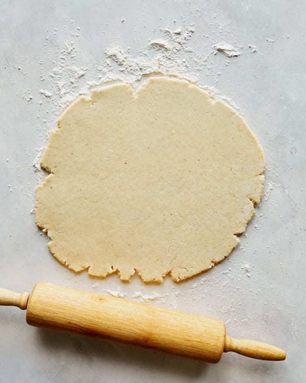 Old fashioned donut dough being rolled out. 