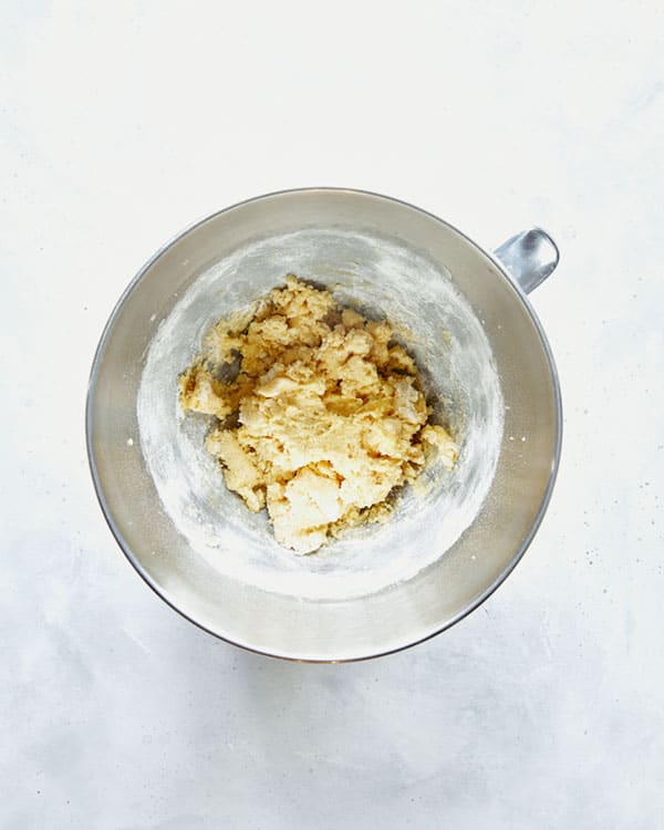 Dough in the bowl of a stand mixer.