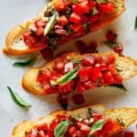 Bruschetta recipe on toasted crostini close up.