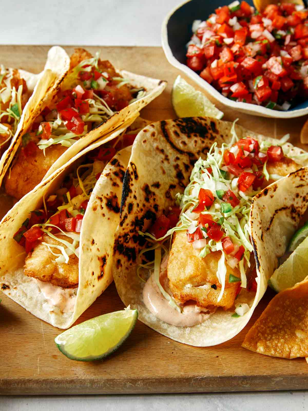 Baja fish tacos with limes and pico de gallo. 