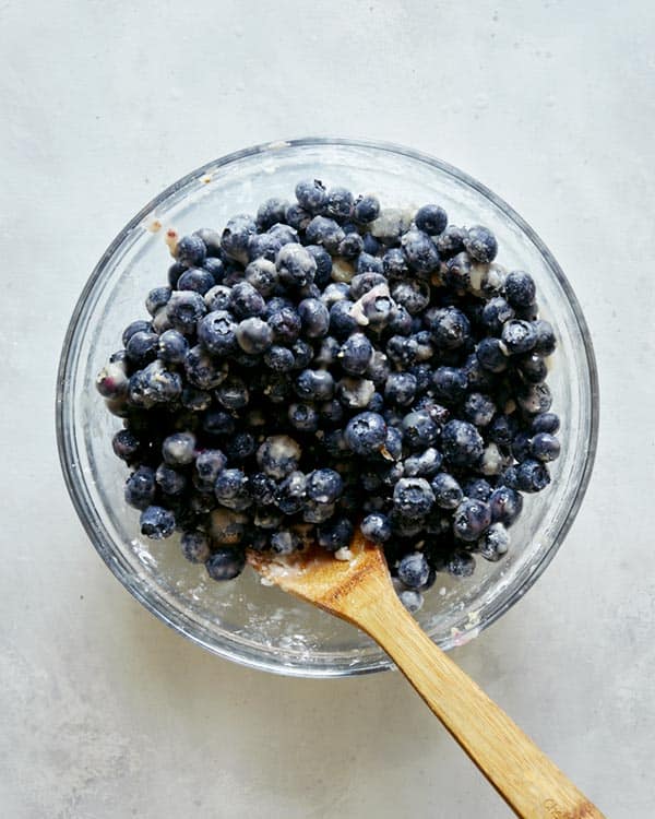 Blueberry cobbler filling ingredients mixed together in a bowl. 