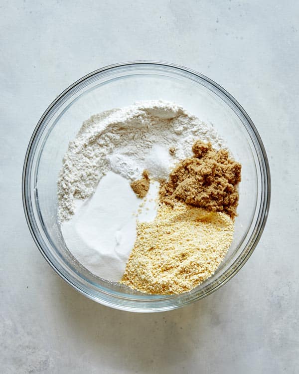 Blueberry cobbler biscuit ingredients in a glass bowl.