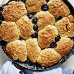 Blueberry cobbler in a skillet freshly baked.