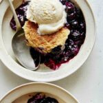 Blueberry cobbler recipe served into two bowls.