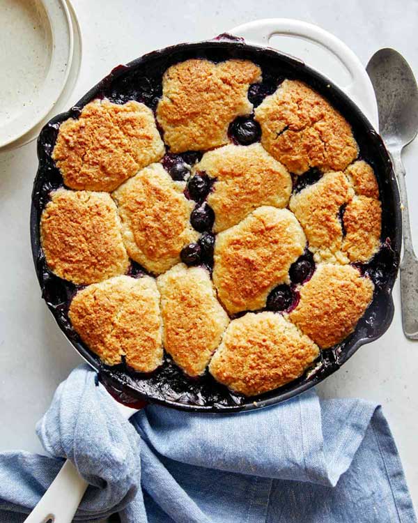 Blueberry cobbler in a skillet freshly baked.