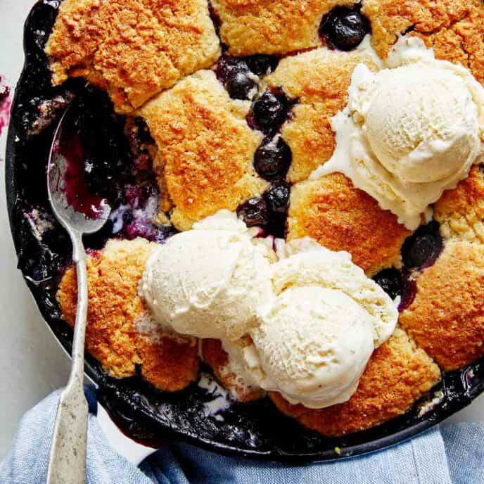 Blueberry cobbler recipe in a skillet.