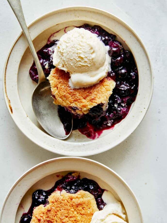 Blueberry cobbler recipe served into two bowls.