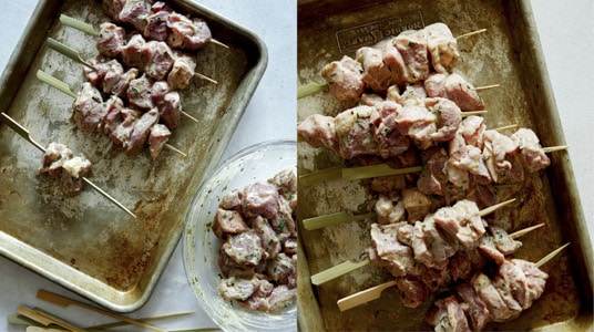 Skewering lamb kabobs to prepare them to grill.