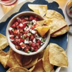 Pico de gallo recipe with chips and beer.