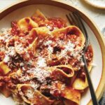 Bolognese sauce recipe in a bowl with a fork.