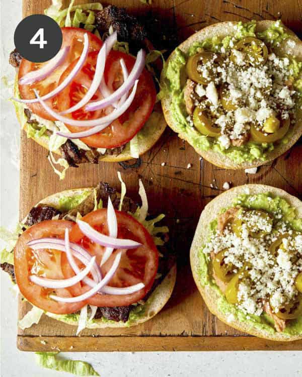 A carne asada torta recipe ready to be topped with a bun.