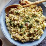 Creamy potato salad with beers on the side.