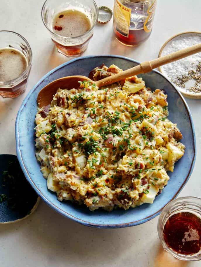 Creamy potato salad with beers on the side.