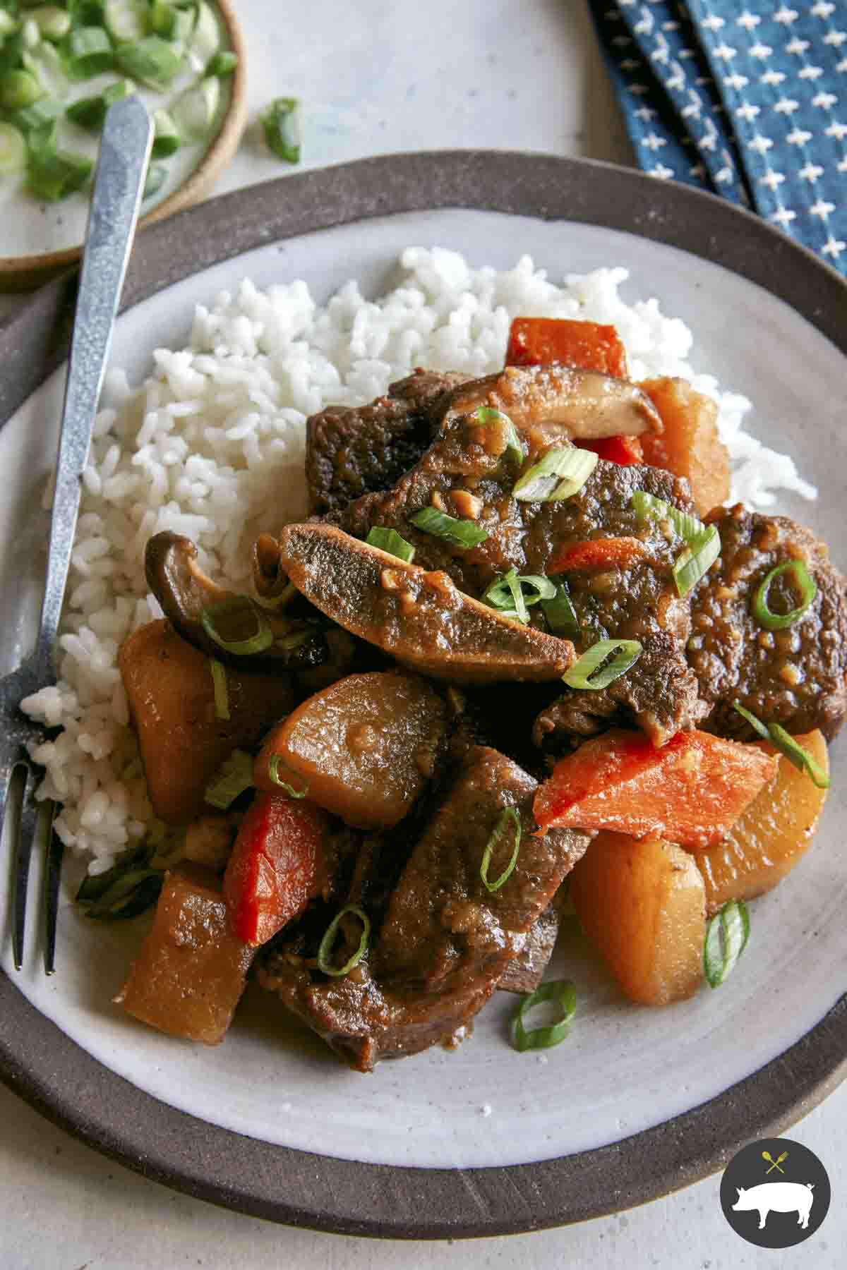 Galbi Jjim | Korean Braised Short Ribs - Spoon Fork Bacon 1 A recipe for glabi jjim plated onto a platter.