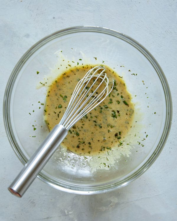 Lamb kabob marinade whisked together in a bowl.