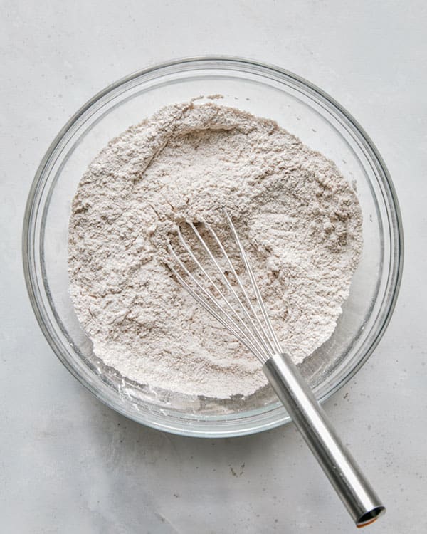 Dry ingredients in a bowl for pumpkin bars recipe.