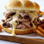 Roast beef sandwich recipe with fries on the side.