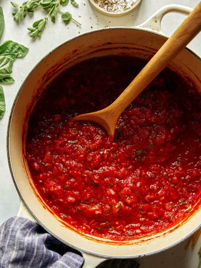 Close up on arrabiata sauce recipe in a pot. 