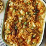 Creamy cauliflower baked recipe in a casserole dish.