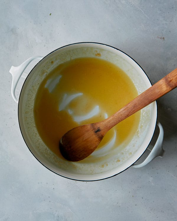 Butter whisked together with flour in a pot.