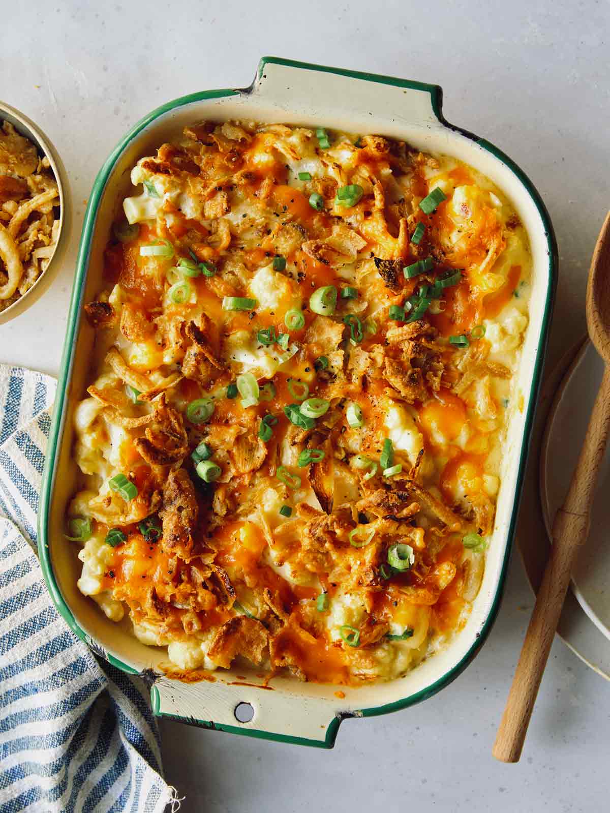 Creamy cauliflower baked recipe in a casserole dish. 