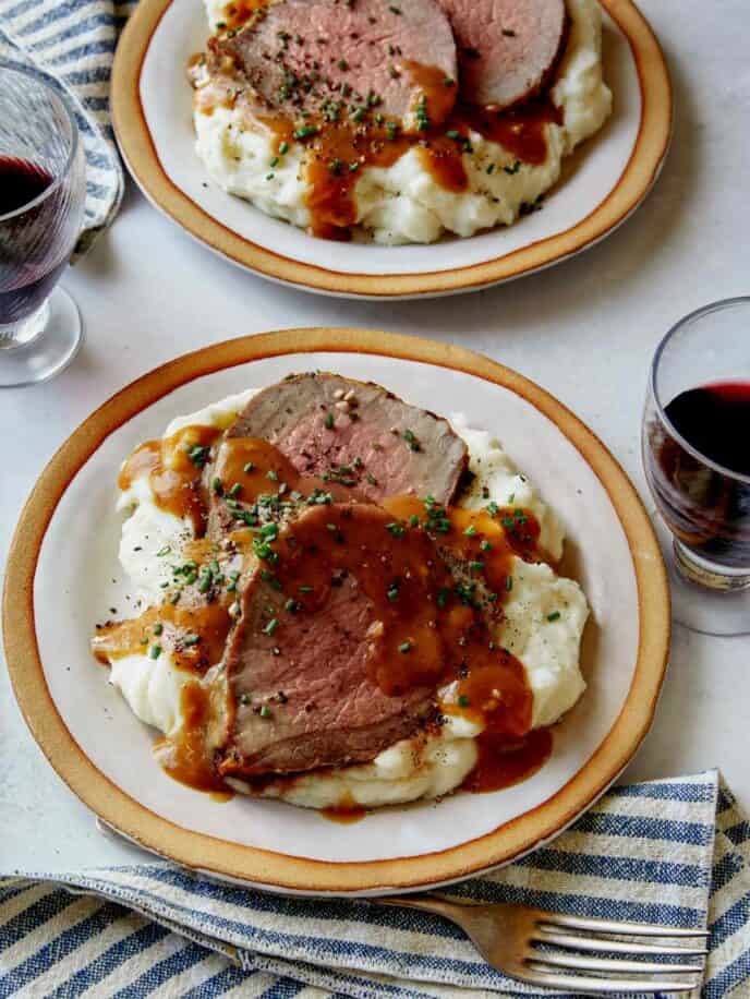 Roast beef recipe with red wine and mashed potatoes, new years eve food. 