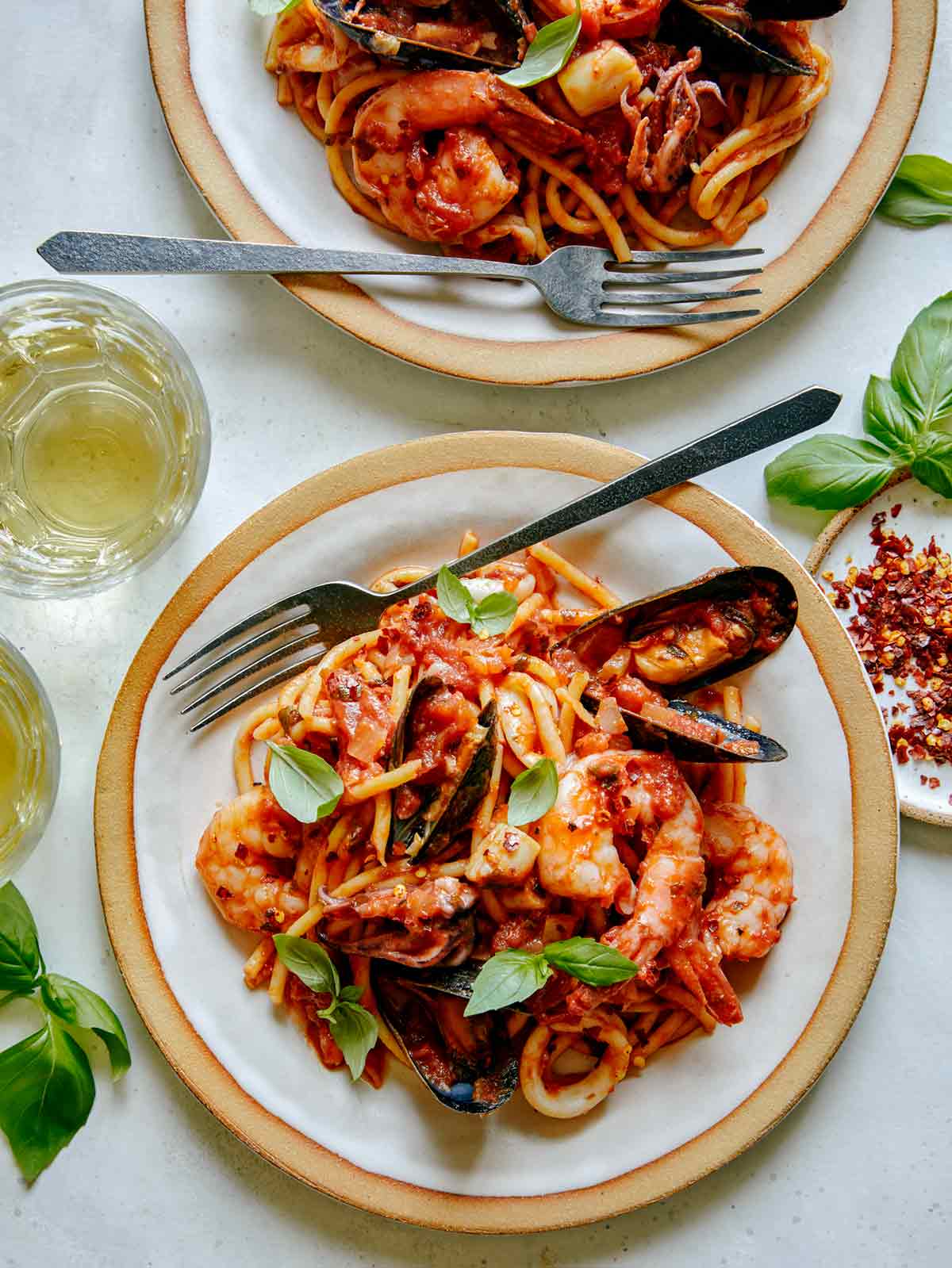 Frutti Di Mare served onto two plates. 