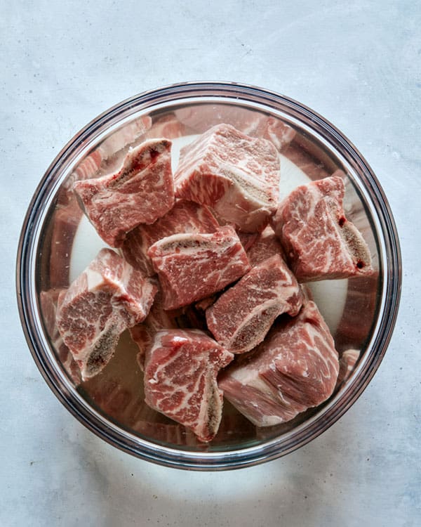 Short ribs for galbi jjim soaking in water.