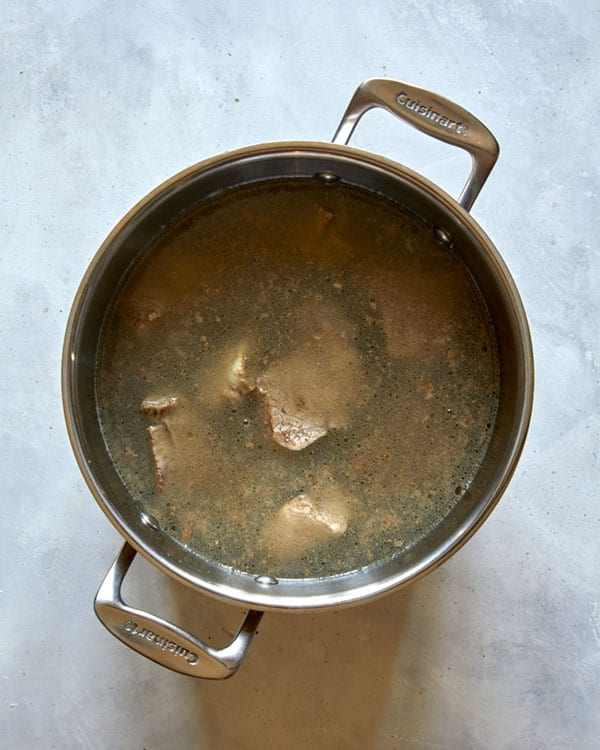 Short ribs boiled in a pot of water.