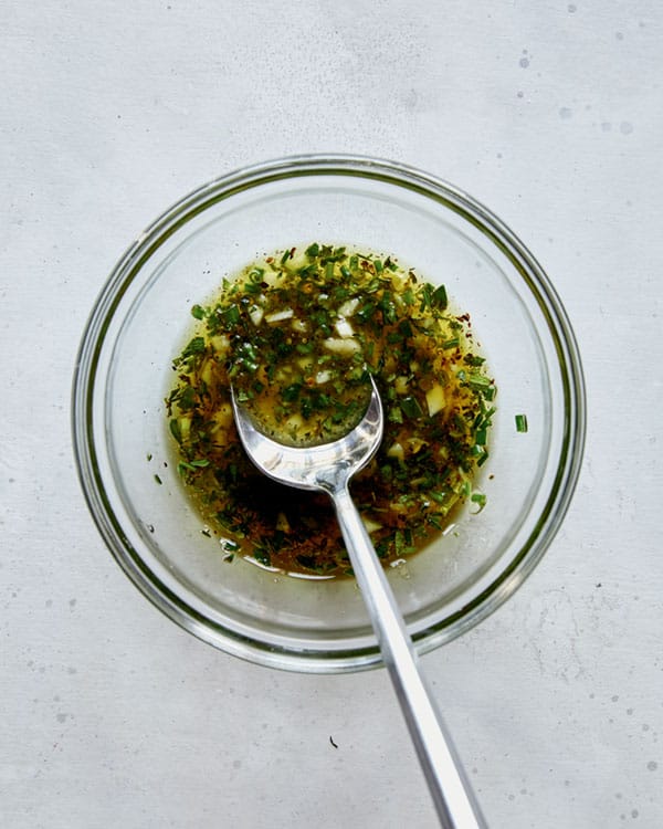 Roast beef marinade whisked together in a bowl.