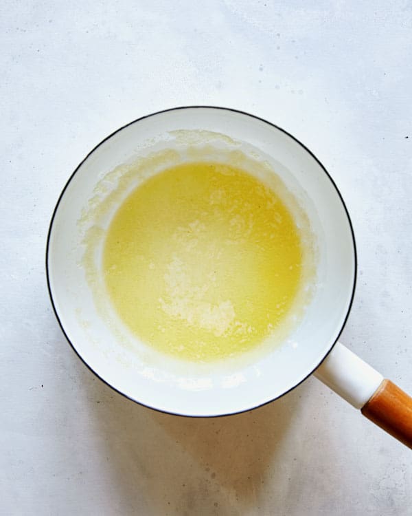 Butter melted in a saucepan to make gravy.