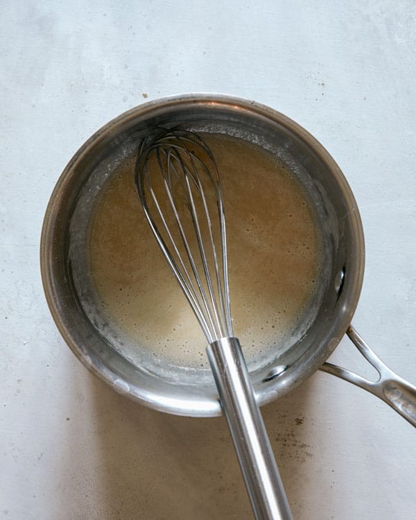Butter and flour whisked together in a pot.
