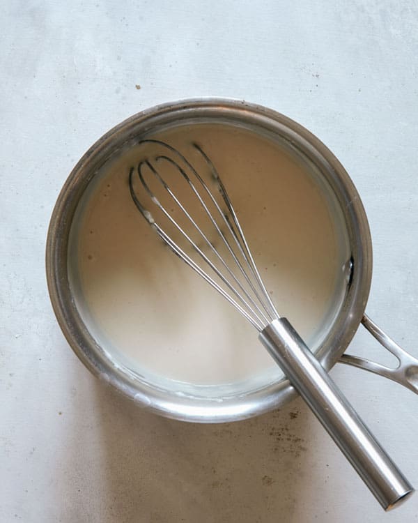 The start of cooking a cheese sauce for a roast beef sandwich recipe.