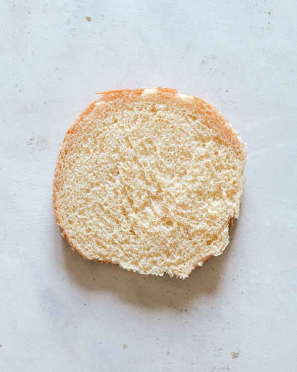 Plain bottom bun for the start of a roast beef sandwich.