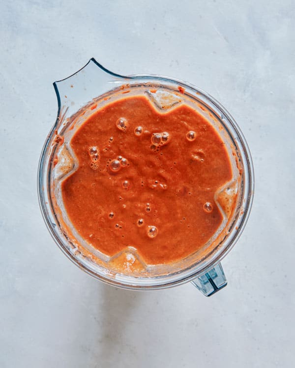 Freshly blended tomato soup in a blender. 