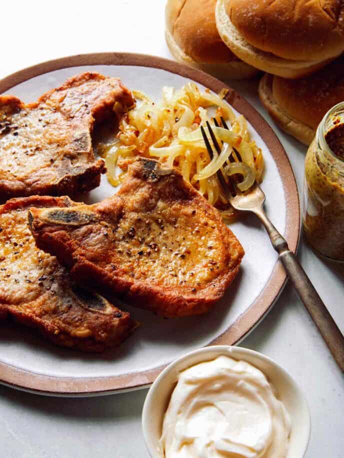 Ingredients to assemble a pork chop sandwich.