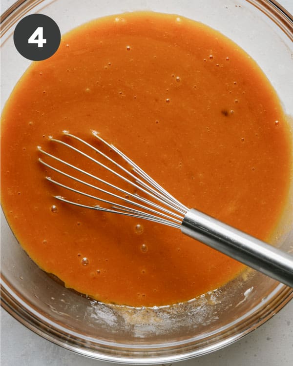 Wet ingredients whisked together to make pumpkin bars recipe. 