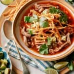 Tortilla soup in a bowl ready to be eaten.