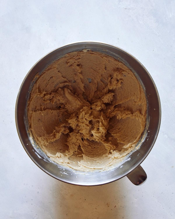 Butter and sugar creamed together in a bowl for M&M cookies.