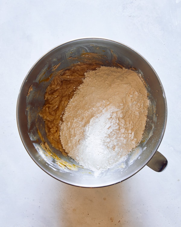 M&M Cookie dough being made in a bowl. 