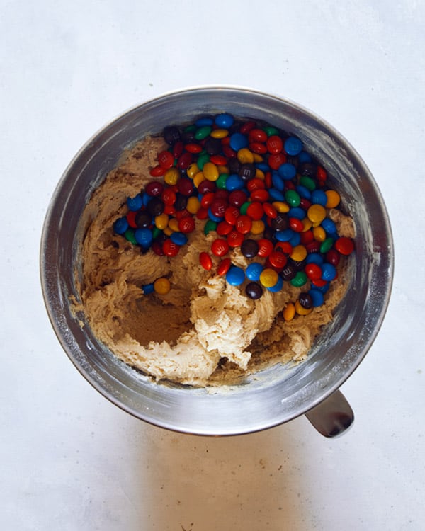 M&M Cookie dough with m&ms in a bowl.