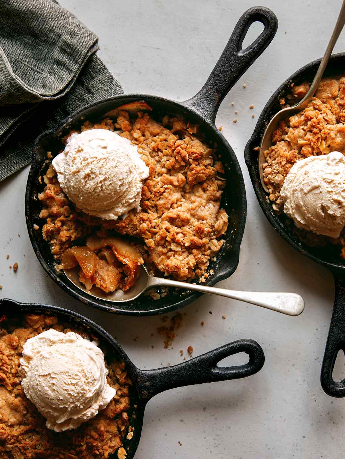 Apple crisp recipe being served with ice cream. 