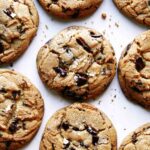 Brown Butter chocolate chip cookies laid out on a kitchen counter.