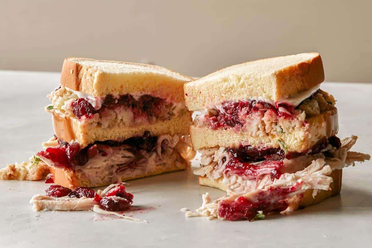 Thanksgiving moist maker sandwich cut in half.