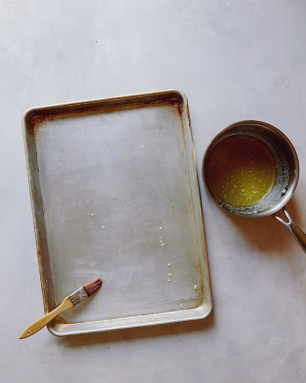 Butter a baking sheet.
