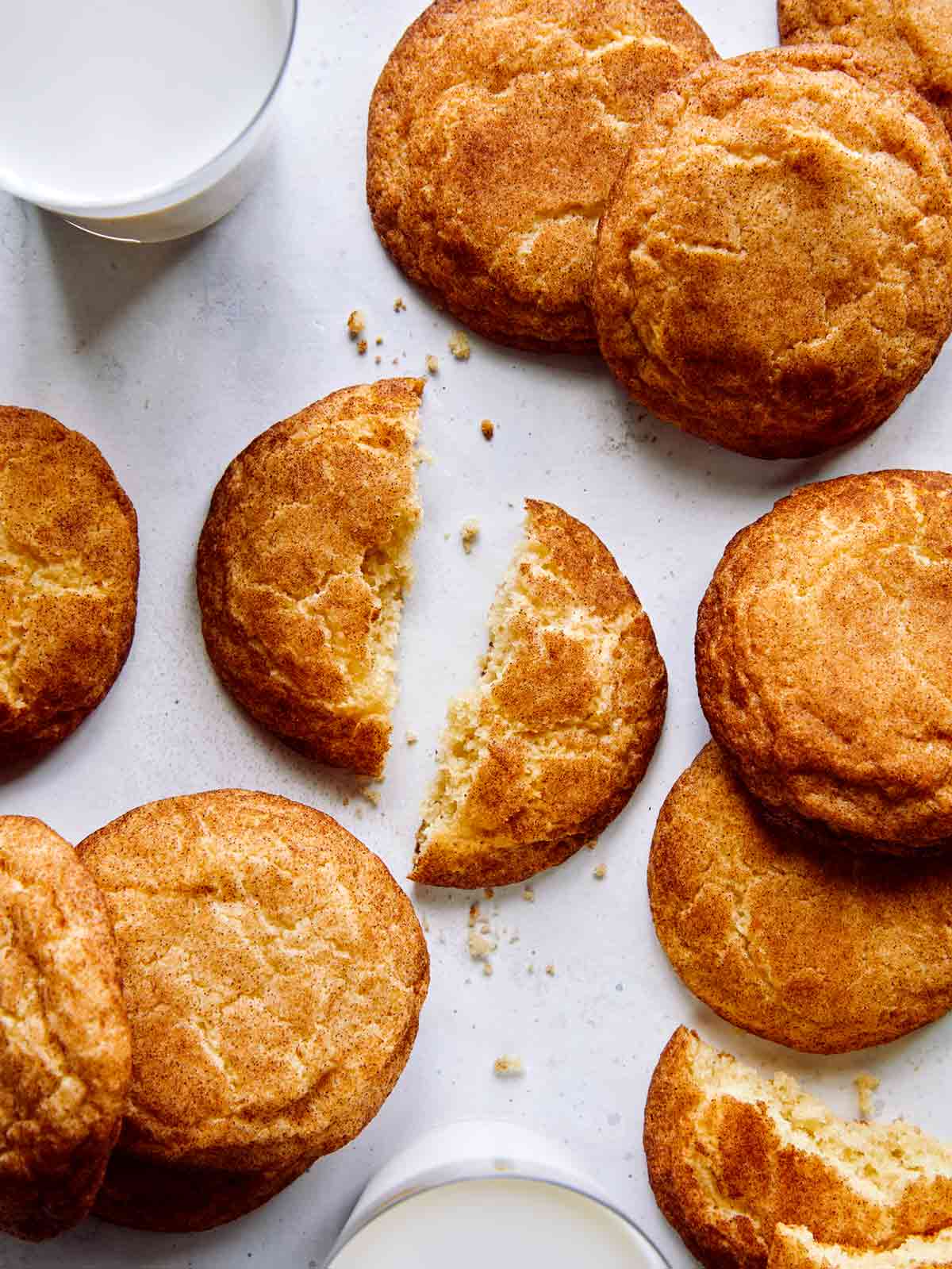 Snickerdoodle cookie recipe with one broken in half.