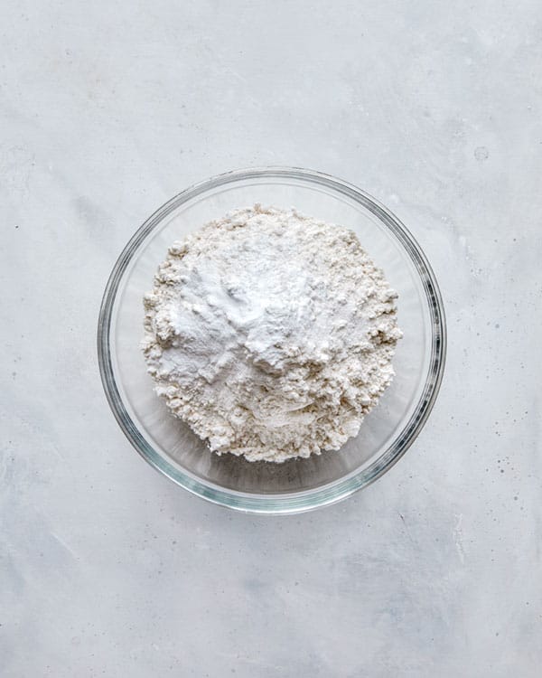 Flour in a glass bowl.