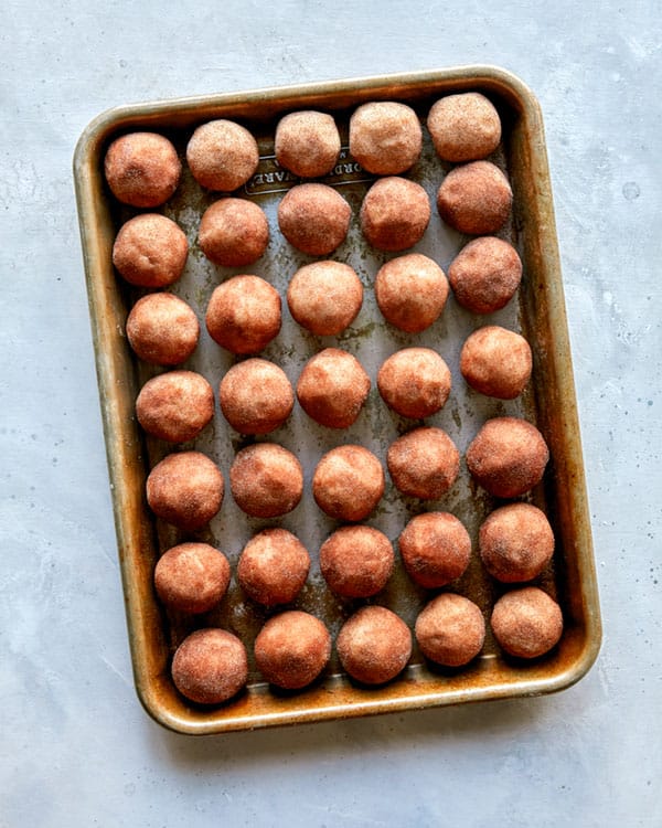 Snickerdoodle cookie dough in a baking sheet.